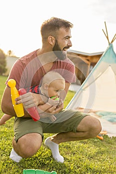 Father playing with his son outdoors