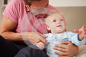 Father Playing With Young Son Indoors