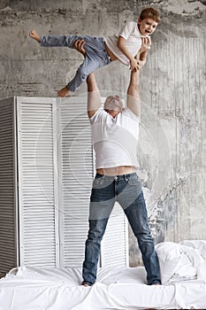 Father plays with son at home. They are home on self-isolation.