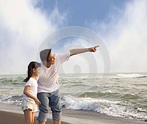 Father pointing and little girl looking