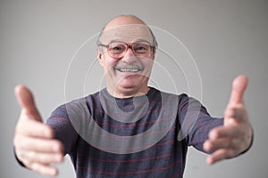 Father pulling hands towards camera, wanting to cuddle