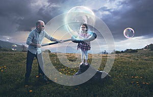 Father putting child in a bubble