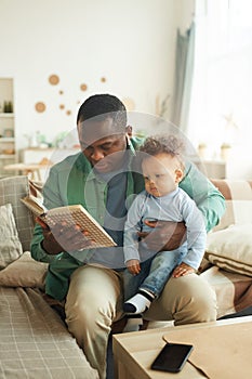 Father Reading Book to Baby