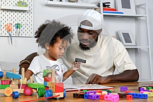 Father is Reading a Book to The Child. The Father is Helping The Child Develop Their Language Skills and Imagination. Father