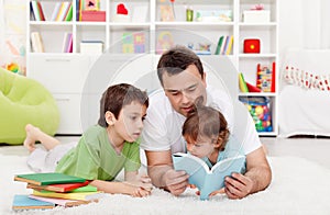 Father reading stories to his boys