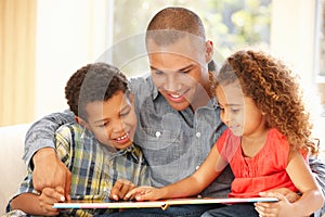 Father reading to children