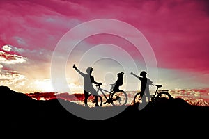 Father riding a bike with family members