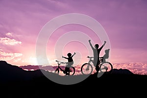 Father riding a bike with family members