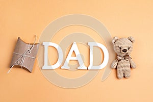 Father`s Day background with toy bear and gift box and copy spac