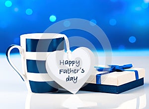 Father`s day blue greeting card,mug and present box with tag.Message