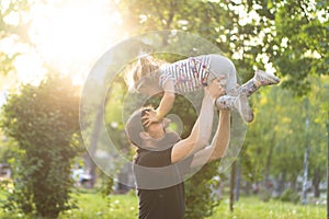 Father`s day celebration. Fatherhood, parenthood, childhood, caring, summer and leisure concept - young dad with beard