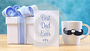 Father`s Day close up of Best Dad Ever greeting card and coffee mug