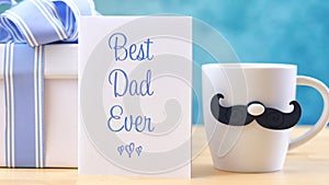 Father`s Day close up of Best Dad Ever greeting card and coffee mug