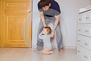 Father`s day concept - Happy family father and baby child son indoors