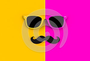 Father`s day concept. Hipster sunglasses and funny moustache on yellow and pink background