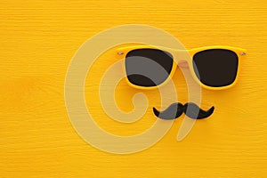 Father& x27;s day concept. Hipster yellow sunglasses and funny moustache