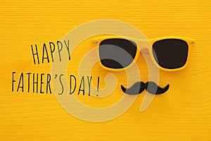 Father& x27;s day concept. Hipster yellow sunglasses and funny moustache