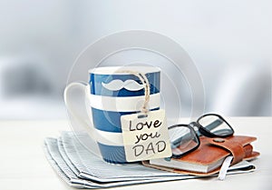 Father`s day concept objects.Coffee mug with tag.