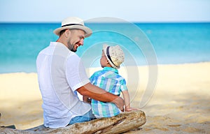 Father`s day. Dad and baby son playing together outdoors on a summer