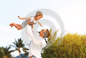 Father`s day. Dad and child daughter playing together outdoors o