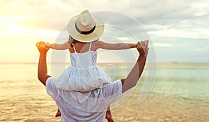 Father`s day. Dad and child daughter playing together outdoors on a summer