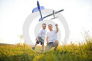 father& x27;s day. Dad and son playing together outdoors on a summer. Happy family, father, son at sunset.