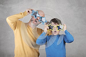 Father`s day,father and son with funny sunglasses