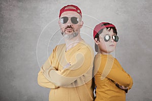 Father`s day,father and son with sunglasses and Cap