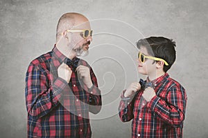 Father`s day,father and son with tie and sunglasses