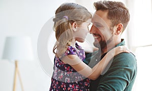 Father`s day. Happy family daughter hugs his dad