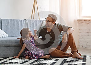 Father`s day. Happy family daughter hugs his dad