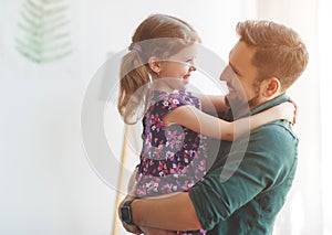 Father`s day. Happy family daughter hugs his dad