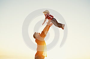 Father`s day. Happy family father and toddler son playing and la