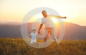 Father`s day. Happy family father and toddler son playing and la