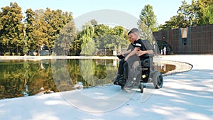 father's day. person with disability. dad and his little cute son are walking in park, on summer day. dad is a