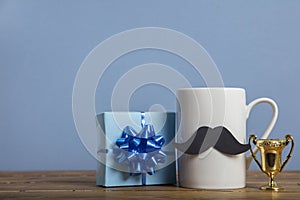 Father`s day present with a coffee mug and paper mustache