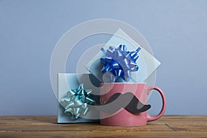 Father`s day present with a coffee mug and paper mustache