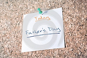 Father's Day Reminder For Today On Paper Pinned On Cork Board photo