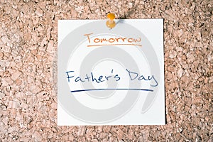 Father's Day Reminder For Tomorrow On Paper Pinned On Cork Board photo
