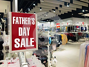 Father`s Day sale. Red stand discount price in shop. November season sale, shopping concept.