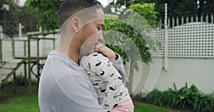 Father, sad and hug child to comfort, love and calm for care at home backyard outdoor. Dad, girl and embrace kid with