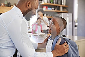 Father Saying Goodbye To Son As He Leaves For School