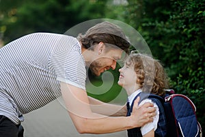 The father sees his son at school first-grader