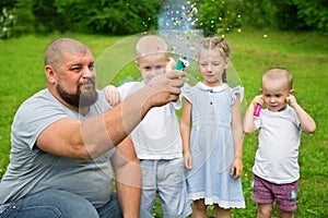Father shoots of the firecracker with confetti