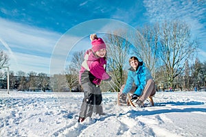 Father sitting on sledges