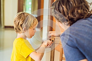 Father and son assembling furniture. Boy helping his dad at home. Happy Family concept