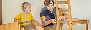 Father and son assembling furniture. Boy helping his dad at home. Happy Family concept BANNER, LONG FORMAT