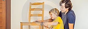 Father and son assembling furniture. Boy helping his dad at home. Happy Family concept BANNER, LONG FORMAT