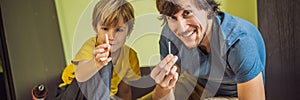 Father and son assembling furniture. Boy helping his dad at home. Happy Family concept BANNER, LONG FORMAT