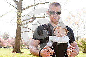 Father with Son in Baby Carrier